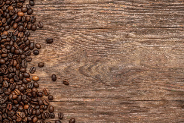 istock Roasted coffee beans on a wooden board, directly above 1367891891