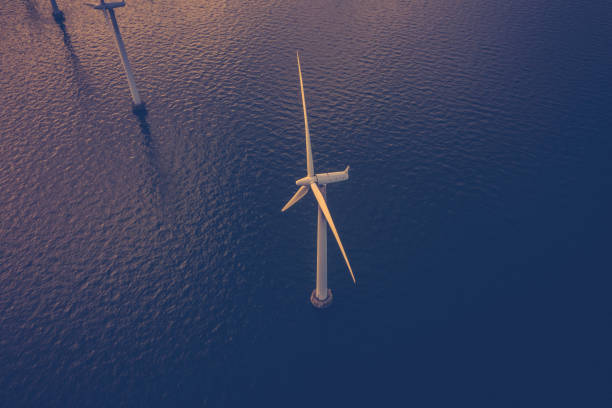 Wind turbines at sea stock photo