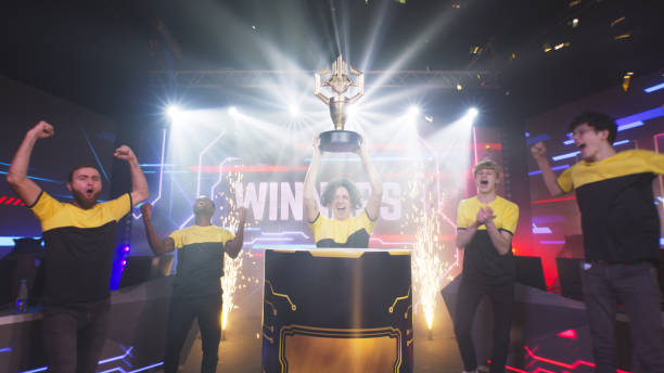 istock Diverse gamers taking trophy after tournament 1367892904