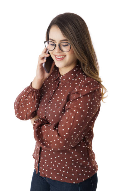 istock Happy woman talking on phone and looking down 1367893194