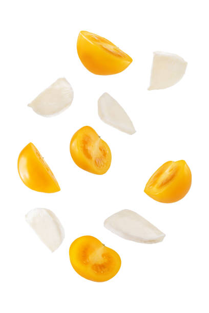 istock Yellow tomatoes basil pepper mozzarella salad in a bowl on a white isolated background 1367893245