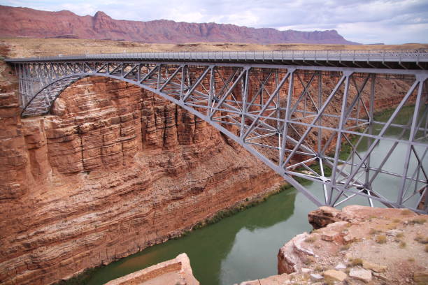 istock Glen Canyon Arch Dam Bridge over the Colorado river waters 1367893859