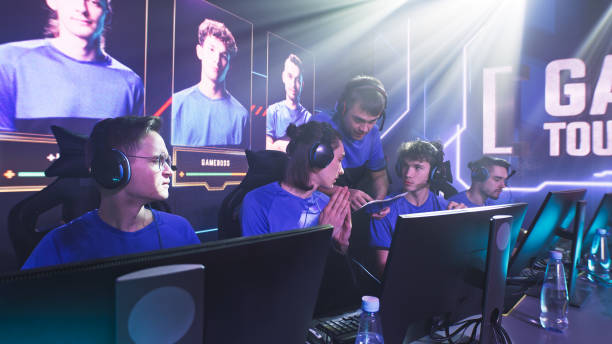 istock Young cyber sportsmen discussing strategy with coach 1367893861