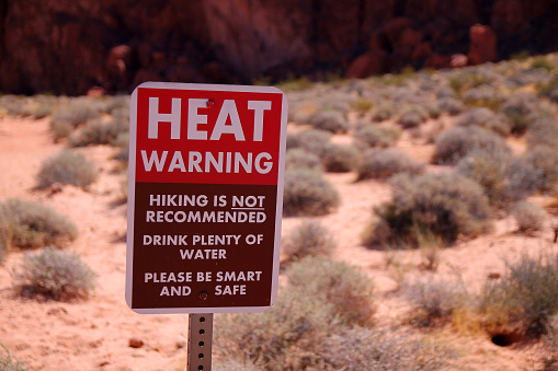 Heat Warning, Hiking is not recommended, drink plenty of water, please be smart and safe sign in the Valley of Fire State Park in Nevada