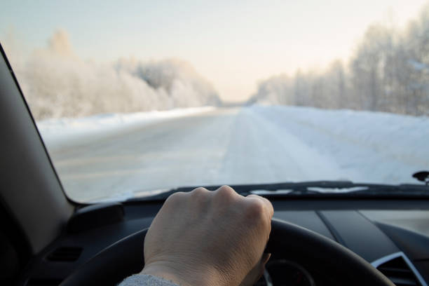 istock Driving a car in winter on a winter highway on ice. 1367897035