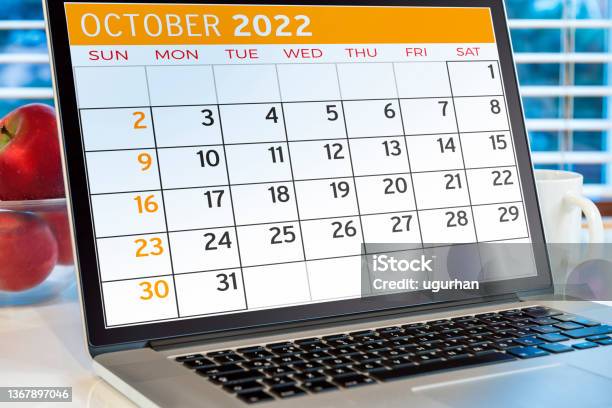 Calendar On Computer Screen Stock Photo - Download Image Now - 2022, Above, Apple - Fruit