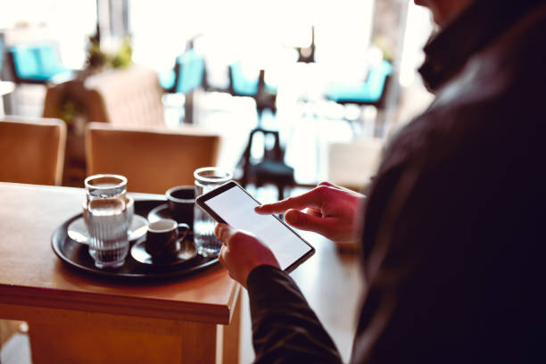 istock Busy Waiter Deciding To Put Hunger First, And Ordering Himself Lunch On Smartphone 1367898614