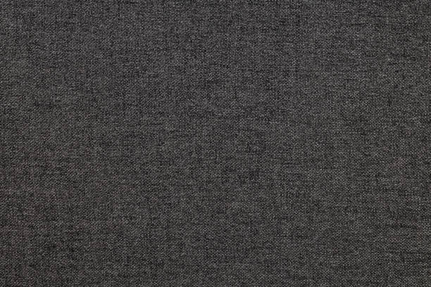 istock Dark gray linen fabric texture close up 1367898789