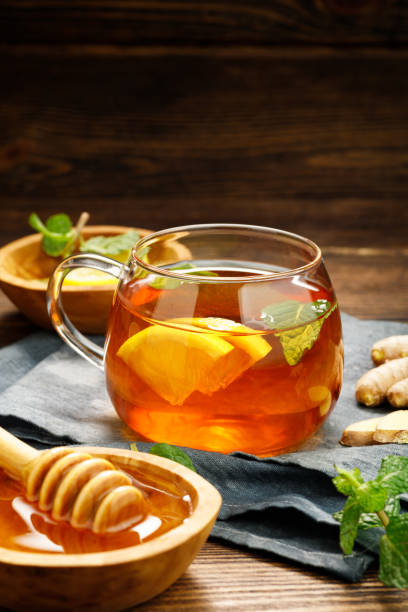 istock A glass cup of hot tea with lemon, mint and ginger. 1367899834