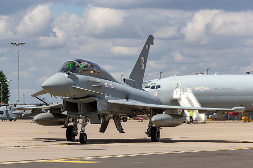 Lincolnshire, UK - July 7, 2014: Royal Air Force (RAF) Eurofighter EF-2000 Typhoon T.3 ZK383 fighter aircraft from No.29 Squadron taxiing at Waddington.