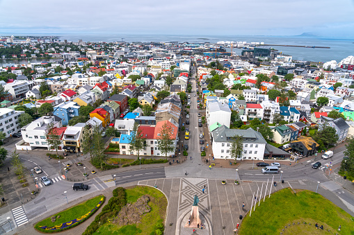 View over downtown Reykjavik, from the top of Hallgrimskirkja. Traditional Icelandic colorful houses and incidental pedestrians.
