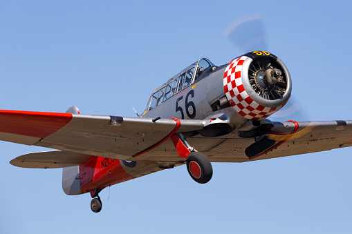 Tyabb, Australia - March 9, 2014: Former Royal New Zealand Air Force (RNZAF) North American AT-6C Harvard training aircraft taking off from Tyabb Airport.