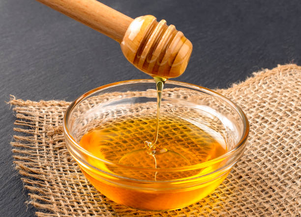 istock Honey on the black background, country style 1367906335
