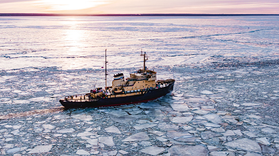 The icebreaker goes on the sea among the ice