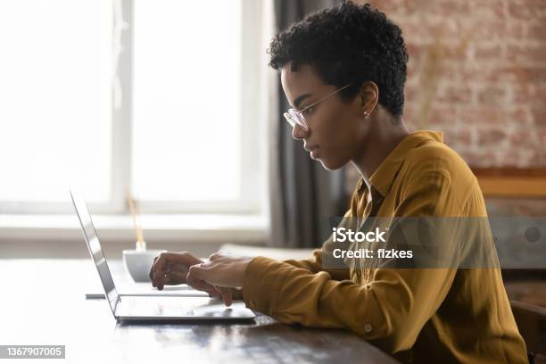 Focused Young African American Businesswoman Working On Computer Stock Photo - Download Image Now