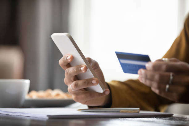 istock Close up young woman purchasing goods in internet store. 1367907007
