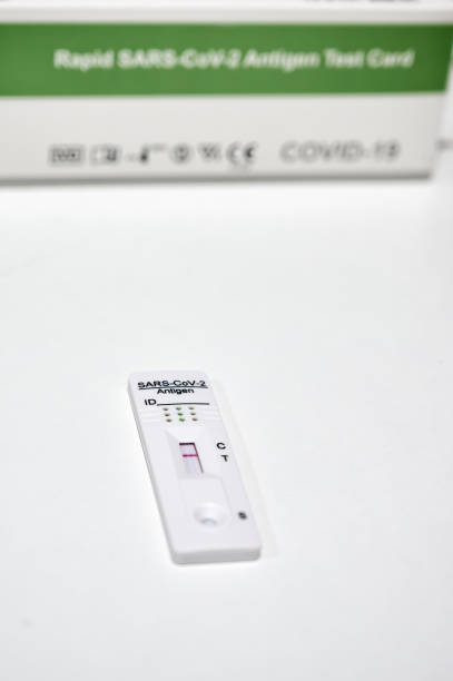 istock Rapid Sars-Cov-2 antigen test card with the marked control band and negative result placed on a table 1367908201