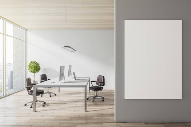 istock Modern concrete office interior with empty white mock up frame on wall, wooden flooring and ceiling, equipment, furniture and window with city view, daylight. 3D Rendering. 1367909132