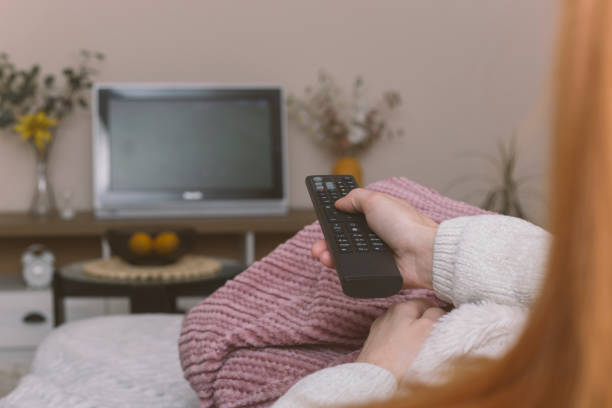 istock Watching tv at home 1367911333