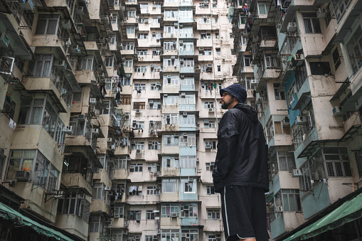 Traveler exploring the urban landscape of Hong Kong, China, one of the most densely populated cities in the world.