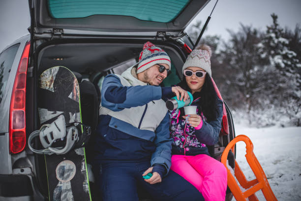 istock Couple drinking hot drink in nature in winter 1367918561