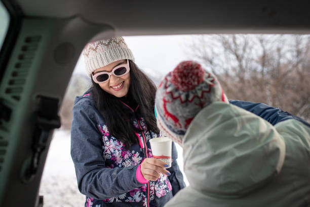 istock Couple drinking hot drink in nature in winter 1367918601