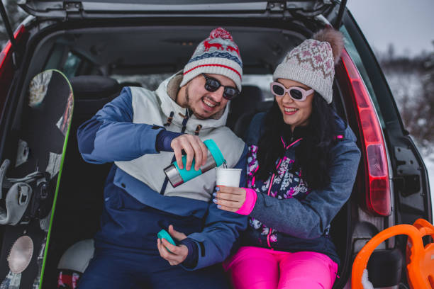 istock Couple drinking hot drink in nature in winter 1367918619