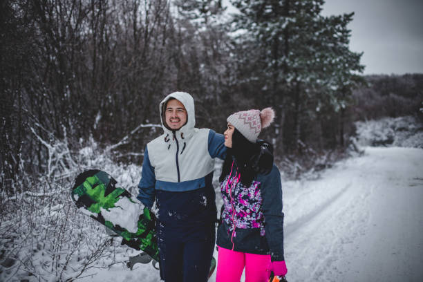 istock Couple walking hugged and enjoying the snow 1367918630