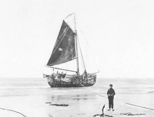 Dutch Fisherman and Boat in the Netherlands (Holland) 1894 Antique Photo A Dutch Fisherman with his fishing boat in 19th century Netherlands (Holland). Photo by Dr. Charles Mitchell commissioned for an 1894 book about Holland. Source: Original edition is from my own archives. Copyright has expired and is in Public Domain. north sea photos stock illustrations