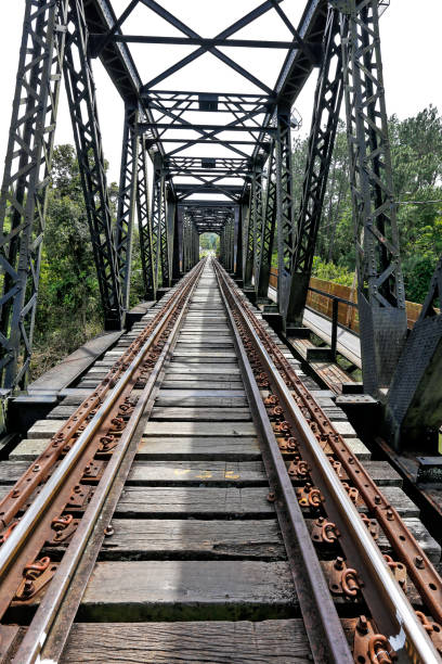 istock Old railway bridge, with iron trellis, in perspective 1367923096