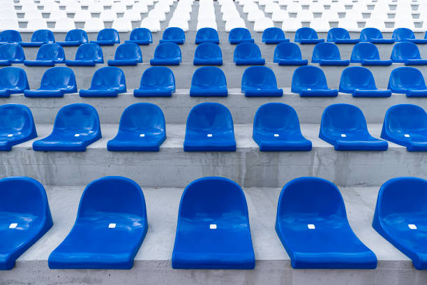istock empty seats on the podium without people. Rows of blue plastic stadium seats. 1367926400