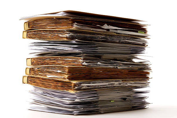 istock Isolated shot of stacked file folders on white background 136792792