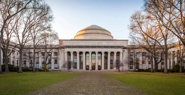 MIT in Cambridge Cambridge, MA, USA - October 10, 2017: view of the architecture of the iconic Massachusetts Institute of Technology in Cambridge, MA, USA with some locals, tourists, and students passing by. clothing north america usa massachusetts stock pictures, royalty-free photos & images