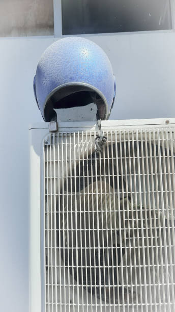 istock helmet and air conditioner 1367933576