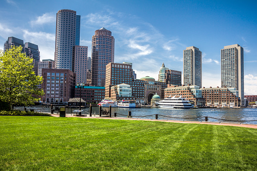 View of the architecture of Boston in Massachusetts, USA showcasing the Boston Harbor and Financial District with its mix of contemporary and historic buildings.