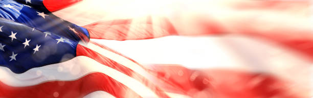 istock Close up shiny American flag with beam of light 1367936767