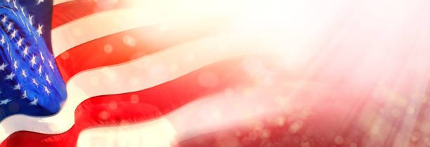 istock Close up shiny American flag with beam of light 1367936768