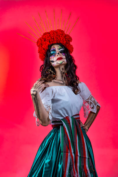 pose mexican catrina mexican catrina with fucsia background. dark pink dress stock pictures, royalty-free photos & images