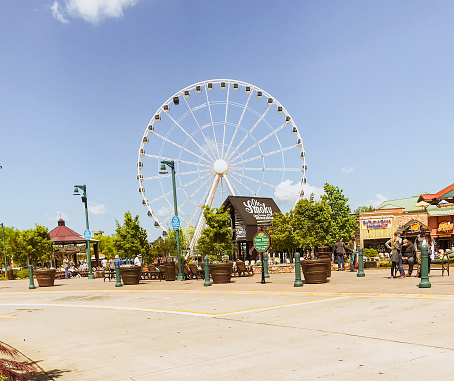 April 27, 2018.  Pigeon Forge, Tennessee. Located in the Appalachian Mountains, Pigeon Forge is a tourist destination for many. Full of shops, a ferris wheel, good food, and various shops, this is a great place for the whole family. Pigeon Forge originally was created as a 19th-century iron forge along the Little Pigeon River.