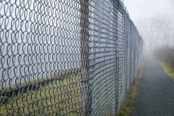 istock Fence In The Fog 1367947245