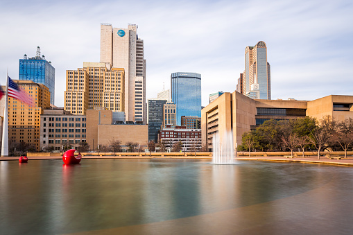 Dallas, Texas, USA - January 30th, 2022: Beautiful view of the downtown buildings with a fountain in the foreground