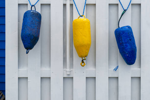 Colorful buoys hanging on a shed in Nova Scotia, Canada.