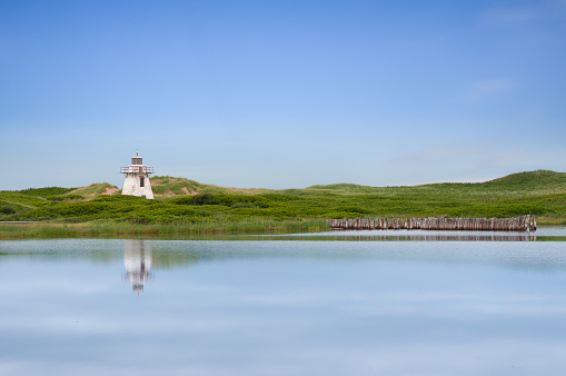 Scenic view of the lighthouse in St. Peter Harbour, Prince Edward Island. Canada