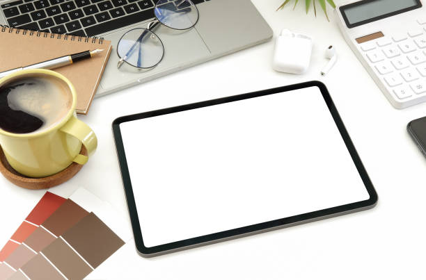 istock Creative designer workspace with digital tablet, laptop computer, coffee cup and colour swatches. 1367949711