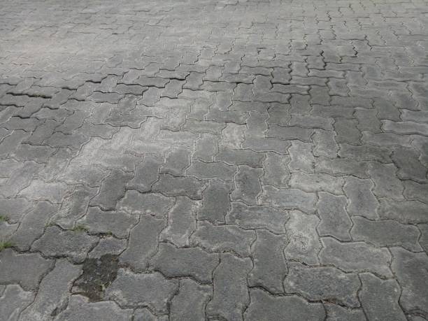 istock cracked and dirty brick paving roads 1367949835