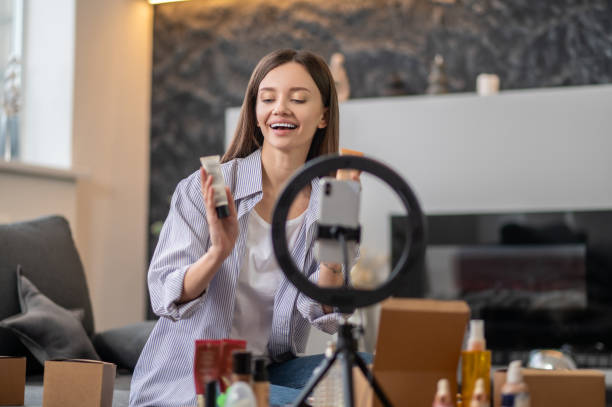 istock Smiling pretty woman presenting new cosmetics 1367953511
