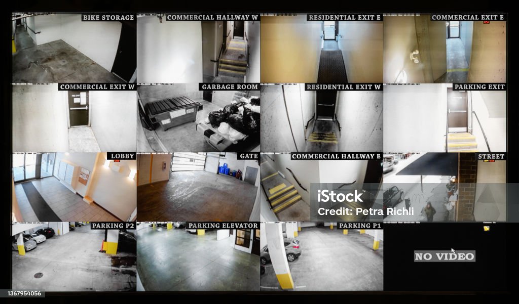 Security camera monitoring screen with 16 camera slots. Small high end system of residential, commercial or strata building. Parking, gate, garbage and recycling room, staircase and hallway. Security Camera Stock Photo