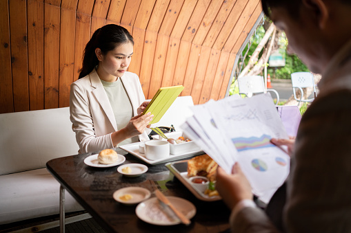 Colleagues work together at a restaurant. Business Dining with a Sense of Place.