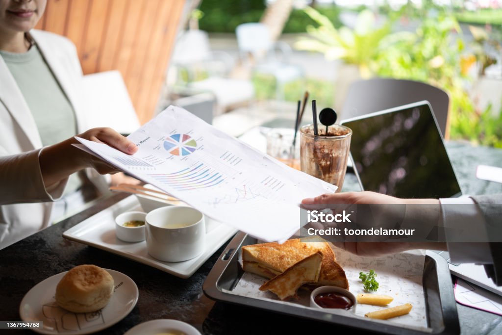 Colleagues work together at a restaurant. Business Dining with a Sense of Place. Business Lunch Stock Photo
