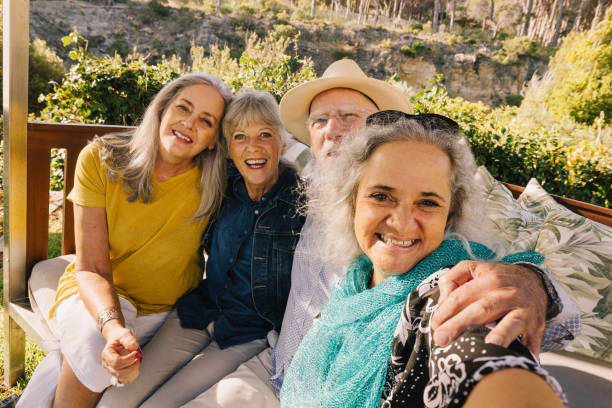istock Happy elderly friends taking a selfie together during vacation 1367956955